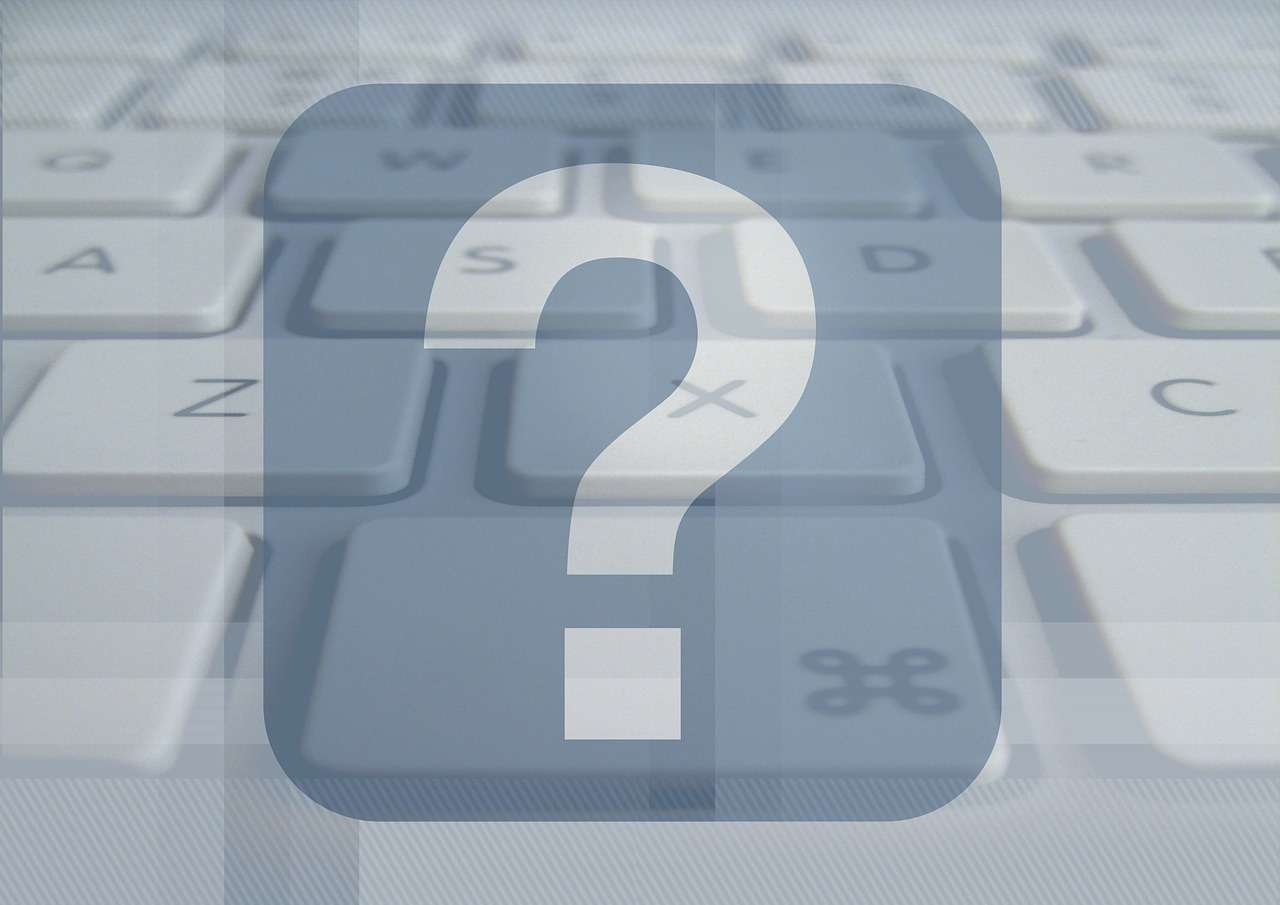 Stylistic image of question mark superimposed over computer keyboard